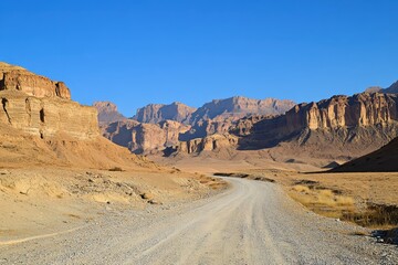 Naklejka premium road at midday clear sky desert mountains background landscape