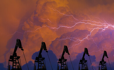Oil beam pump or Donkey pump with dramatic dark sky lightning in teh background - Oil pumps. Oil industry equipment