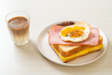 bread toasted cheese topped ham and fried egg with pork sausage