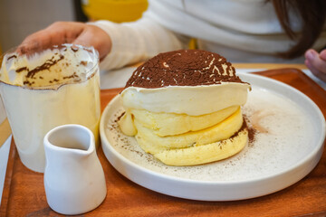 Delicious fluffy pancakes with ice cream. Sweet treat.