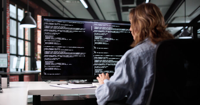 Female Web Developer Innovates Code On Computer