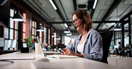Smiling Woman In Call Center Providing Exceptional Customer Support