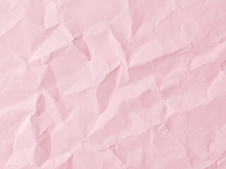 Fototapeta premium Crumpled pink paper texture. Pink wallpaper background 