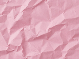 Fototapeta premium Crumpled pink paper texture. Pink wallpaper background 