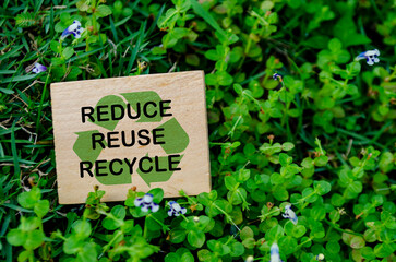 Reduce, Reuse and Recycle text on wooden block. Recycling concept.