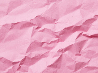 Fototapeta premium Crumpled pink paper texture. Pink wallpaper background 