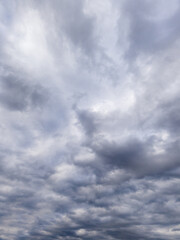 A cloudy sky over a body of water under a cloudy sky