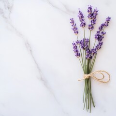 Fototapeta premium lavender stems tied with jute string on marble background, flat lay, rustic elegance.