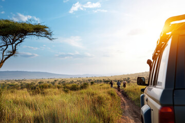 Safari adventure in savannah showcases vehicle on dirt road with travelers exploring landscape under bright sky