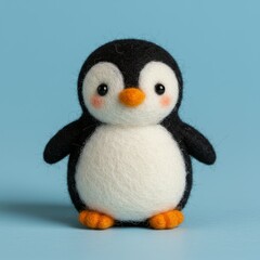 Fototapeta premium Cute felted penguin wool toy, bright colors