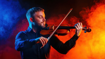Fototapeta premium Expressive photo of violinist playing passionately in colorful smoke. vibrant blue and orange background enhances mood