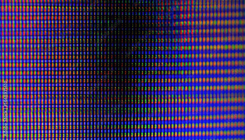 Poster close-up image of a digital screen displaying a grid of colorful pixels, showcasing vibrant hues and