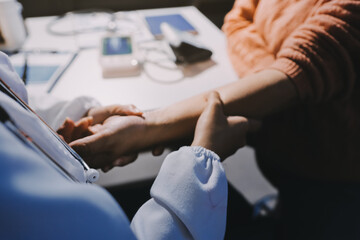 Orthopedist examining patient in hospital