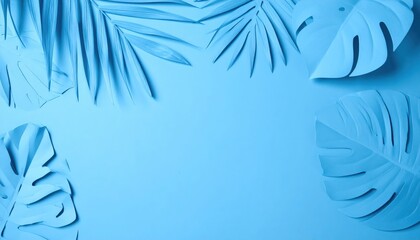 Obraz premium Blue background adorned with cut-out tropical leaves, creating a modern and artistic design that evokes a fresh, tropical vibe