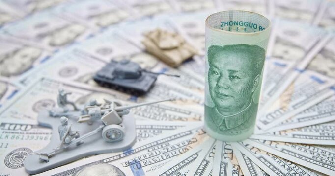 Trade war, reciprocal tariffs, economic power and military might : A juxtaposition of Chinese yuan, miniature military models, and US dollars, symbolizing the interplay of global economic strategies.