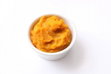 Smooth pumpkin puree mound isolated on white background

