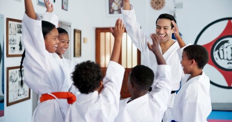 Children, teacher and hands together in dojo for martial arts training, self defense or fighting...