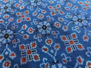 This indigo fabric displays striking geometric motifs, hand block printed with precision.