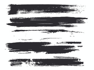 Abstract gray and black brush strokes on white for artistic design.