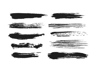 Black ink brush strokes on white background create abstract textures.