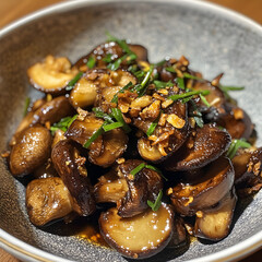 Fototapeta premium A Plate of Sauteed Mushroom with Crispy Fried Garlic and Oyster Sauce