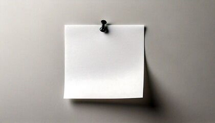 Blank note paper with slightly textured surface, pinned neatly onto a gray wall. target, reminder, goal.
