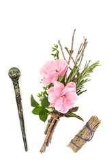 Magic wand, witches herb, twig, rose flower bundle, smudge stick on white. Wicca Pagan and Native...