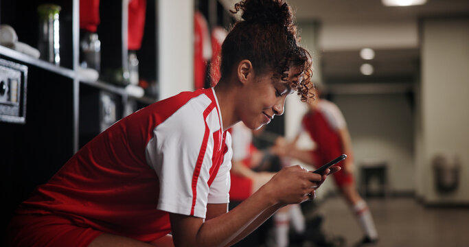 Fitness, watching and woman with smartphone, smile and browsing of video on social media and online. Happy, football player and person with mobile for streaming, healthy and girl with sportswear