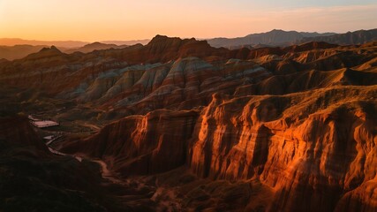 Fototapeta premium Golden Hour Illumination on Red Sandstone Formations in Desert Geological Park Landscape