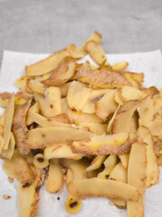 Potato peels drying on paper towel after peeling
