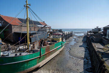 Fishing boats at low tide time in Oosterschelde, Zeeuwse oysters village Yerseke, Zeeland, The...
