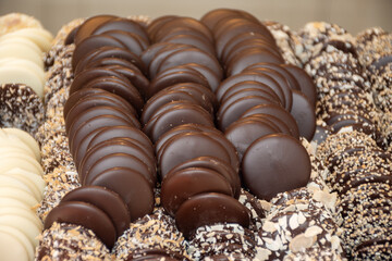 Famous Belgian chocolate candies on display in confectionery shop in Bruges, Belgium
