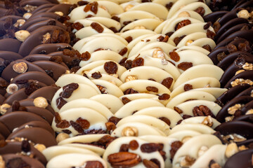 Fototapeta premium Famous Belgian chocolate candies on display in confectionery shop in Bruges, Belgium