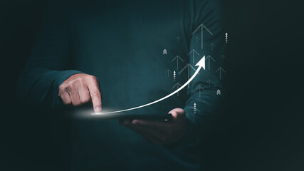 Businessman or trader showing business growth, investing in stock market or digital assets trading,...