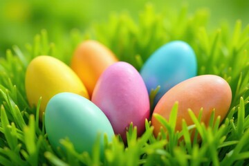 Fototapeta premium A colorful bunch of Easter eggs nestled in fresh spring grass , decoration, meadow