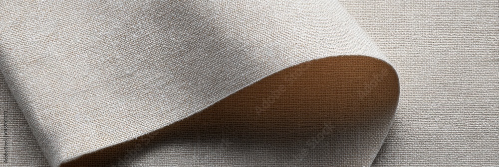Poster smooth linen fabric draped over an iron board, highlighting its soft texture and classic appearance 