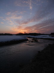 A river with a sunset in the background