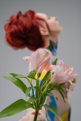 Woman with body art and flowers showcases beauty and creativity