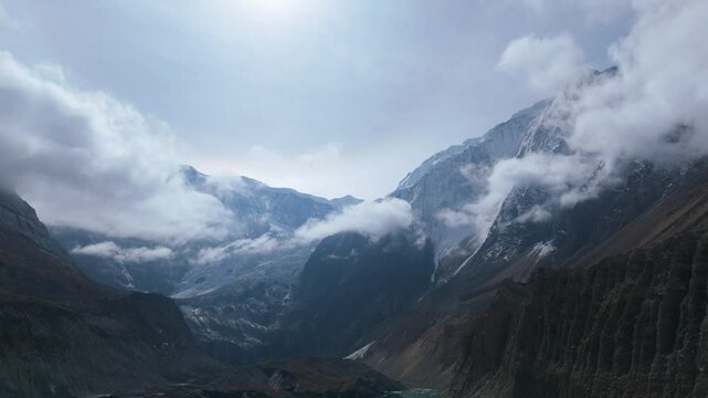 Majestic snowy mountain peak in nepal. Aerial drone moving in 4k - over beautiful mountains in Nepal cold snow winter landscape. Aerial winter landscape snow covered mountains