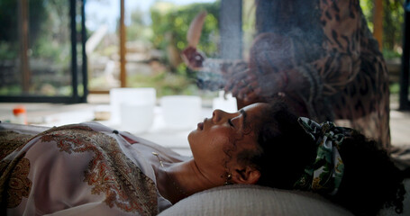Sage, smoke and woman with healer, hands and meditation for self awareness, spiritual and...