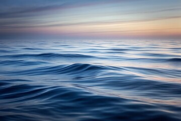 Obraz premium Serene Ocean Horizon Soft Waves at Sunset, High-Resolution Image