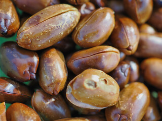 Roasted, shelled, dark brown peanuts