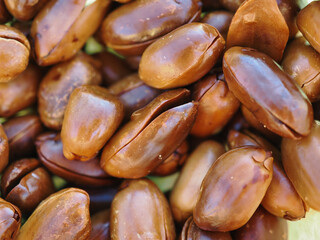Roasted, shelled, dark brown peanuts
