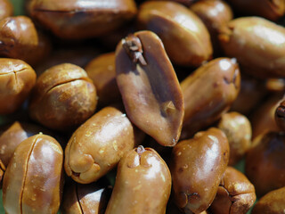 Roasted, shelled, dark brown peanuts