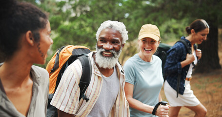 Fitness, laugh and people in nature for hiking, explore environment or journey on trail. Happy group, woman guide and trekking in forest for exercise, explain route or outdoor for wellness activity