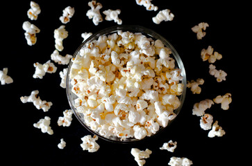 Homemade Salty Popcorn on dark background. Cinema and entertainment concept.