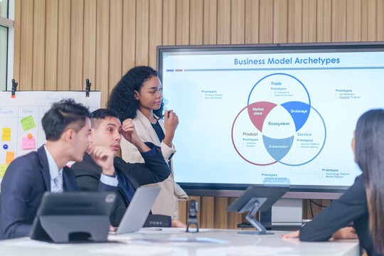 business meeting or seminar,happy multiracial business team conference,presentation with statistic report ,brainstorming in office room