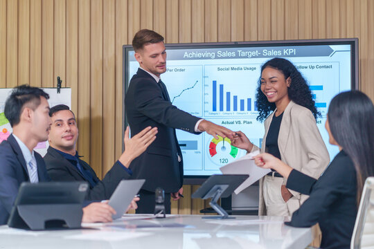 business meeting or seminar,happy multiracial business team conference,presentation with statistic report ,brainstorming in office room