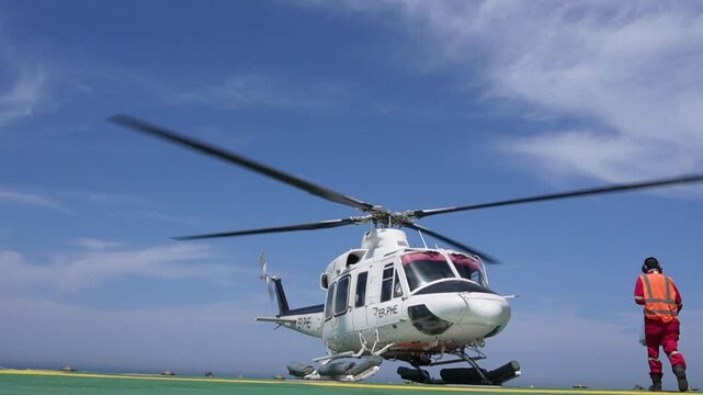 helicopter landing on oil rig