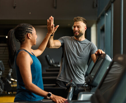 gym sport fitness exercise health training woman teamwork happy together friend success high five trainer instructor gesture support coach motivation treadmill running man trainer instructor coach